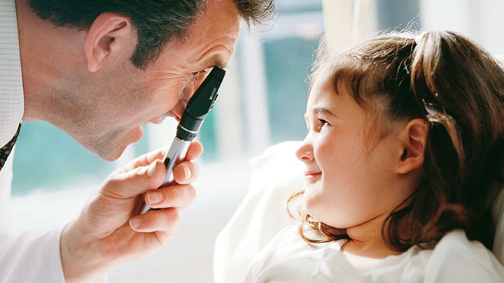 Doctor assessing a child