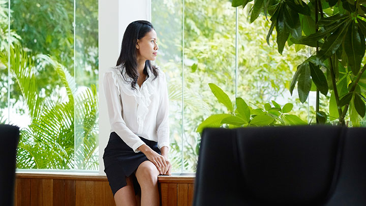 Woman staring out of a hospital window