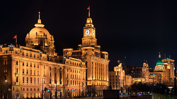 City building facades lit up at night