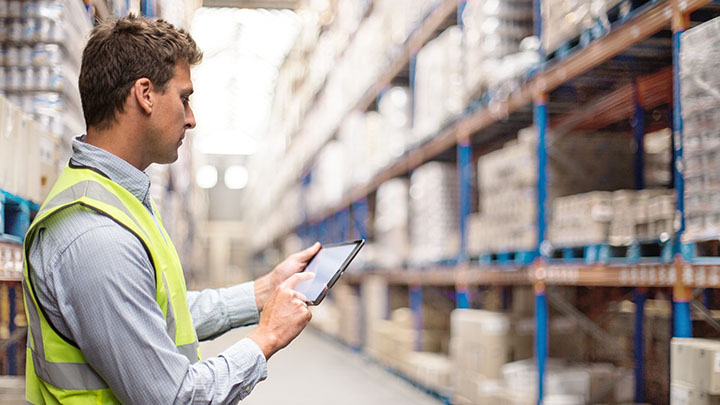 Man on tablet in warehouse