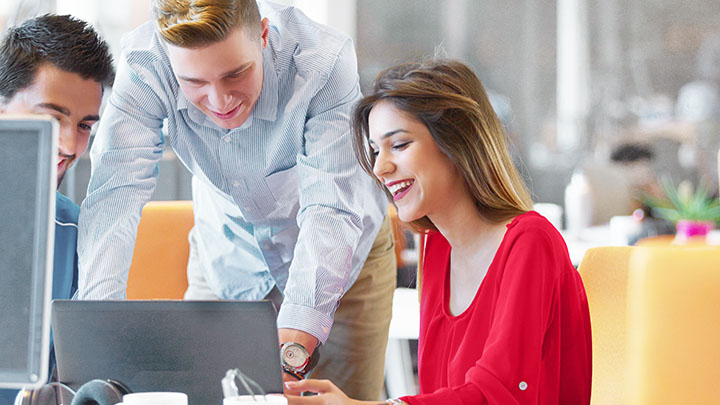 Colleagues working together in office
