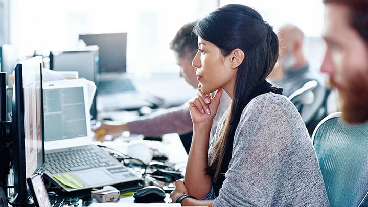 People working on computers in office