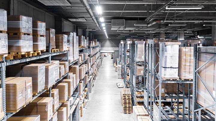A full stocked warehouse with boxes up the ceiling