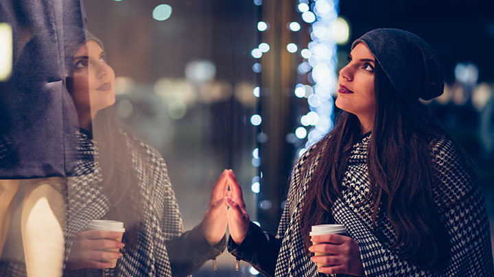 Woman looking at a store window display