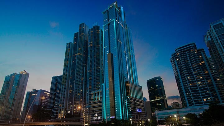 Large Hilton Hotel skyscraper at night