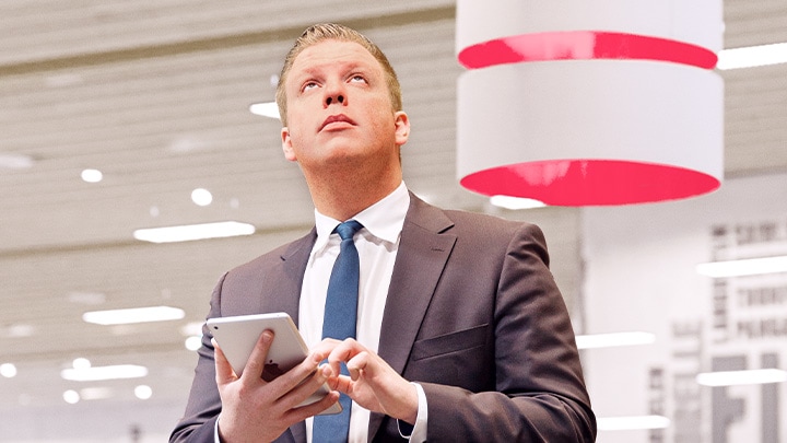 A manager controlling lighting in a retail store
