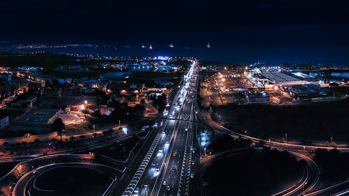 A highway network at night time from the sky